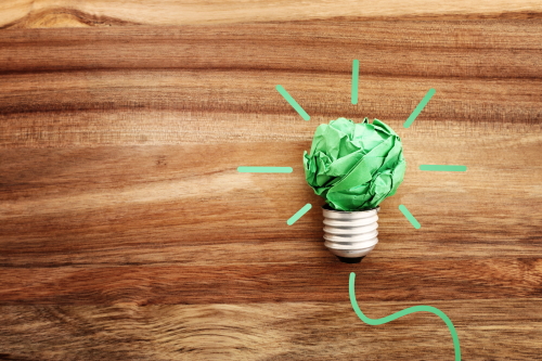 Concept image of green crumpled paper lightbulb